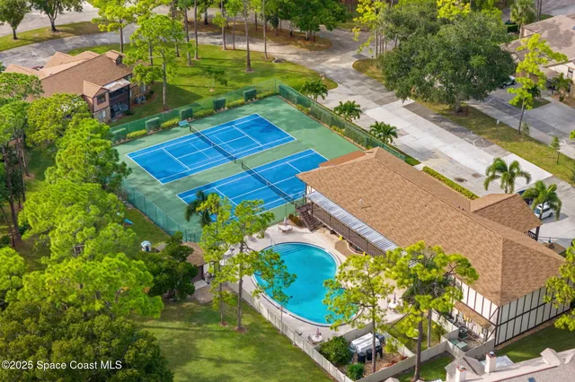 a backyard of a house with yard and outdoor seating