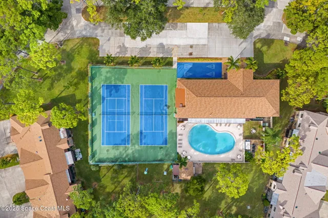 a swimming pool with outdoor seating and yard