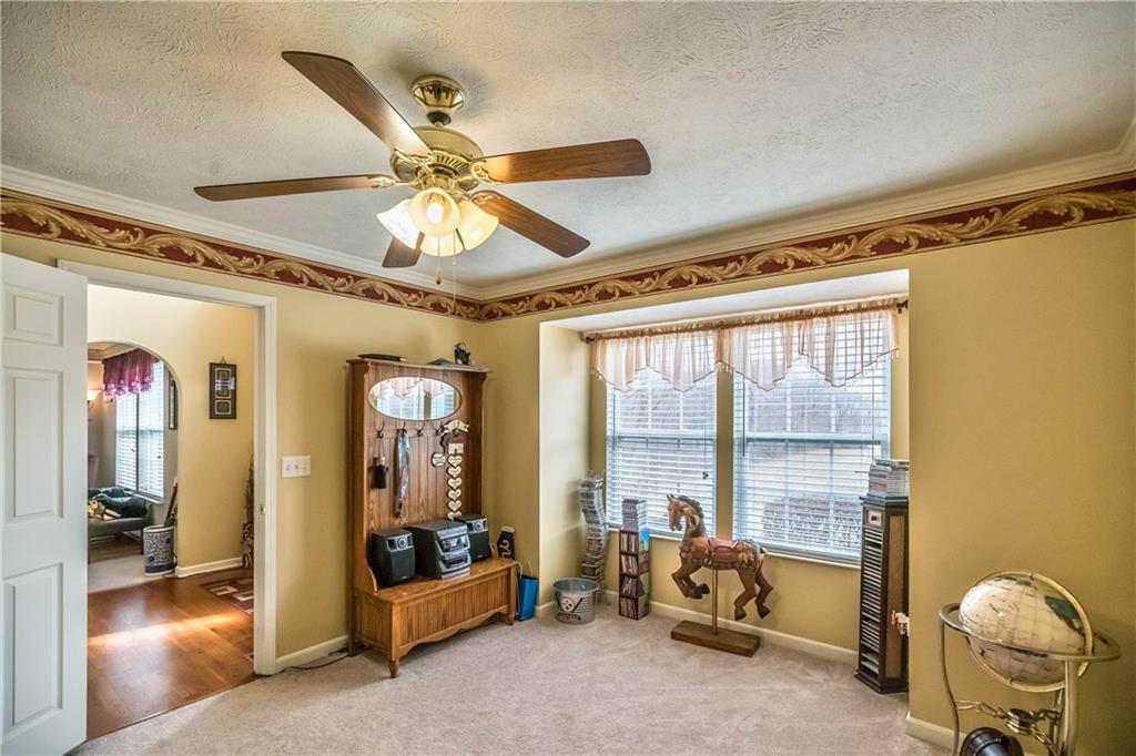 149 Riemer Road Sarver, PA 16055 - Photo 4 of 24 The den area on the first floor with views to the outdoors. This room would also make a lovely office.