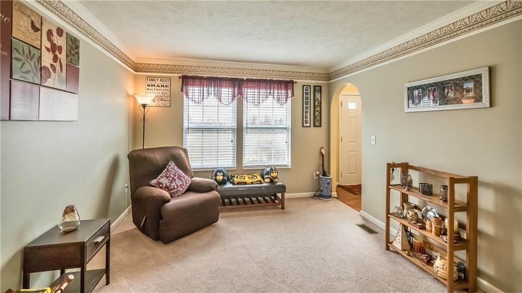 149 Riemer Road Sarver, PA 16055 - Photo 5 of 24 The living room is ample with a large window keeping it bright.