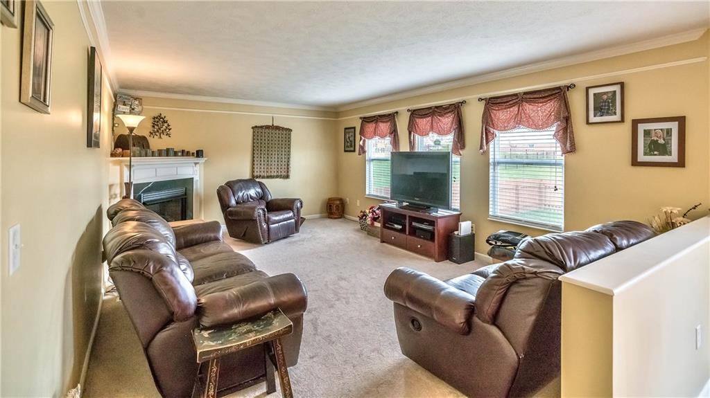 149 Riemer Road Sarver, PA 16055 - Photo 9 of 24 The family room is open to the kitchen and perfect for game day with a fireplace and lots of room for seating!