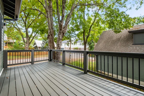 a backyard of a house with plants and tree