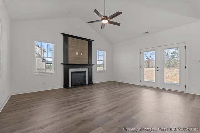 a kitchen with a sink stainless steel appliances and white cabinets