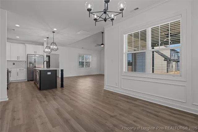 a kitchen with refrigerator and window