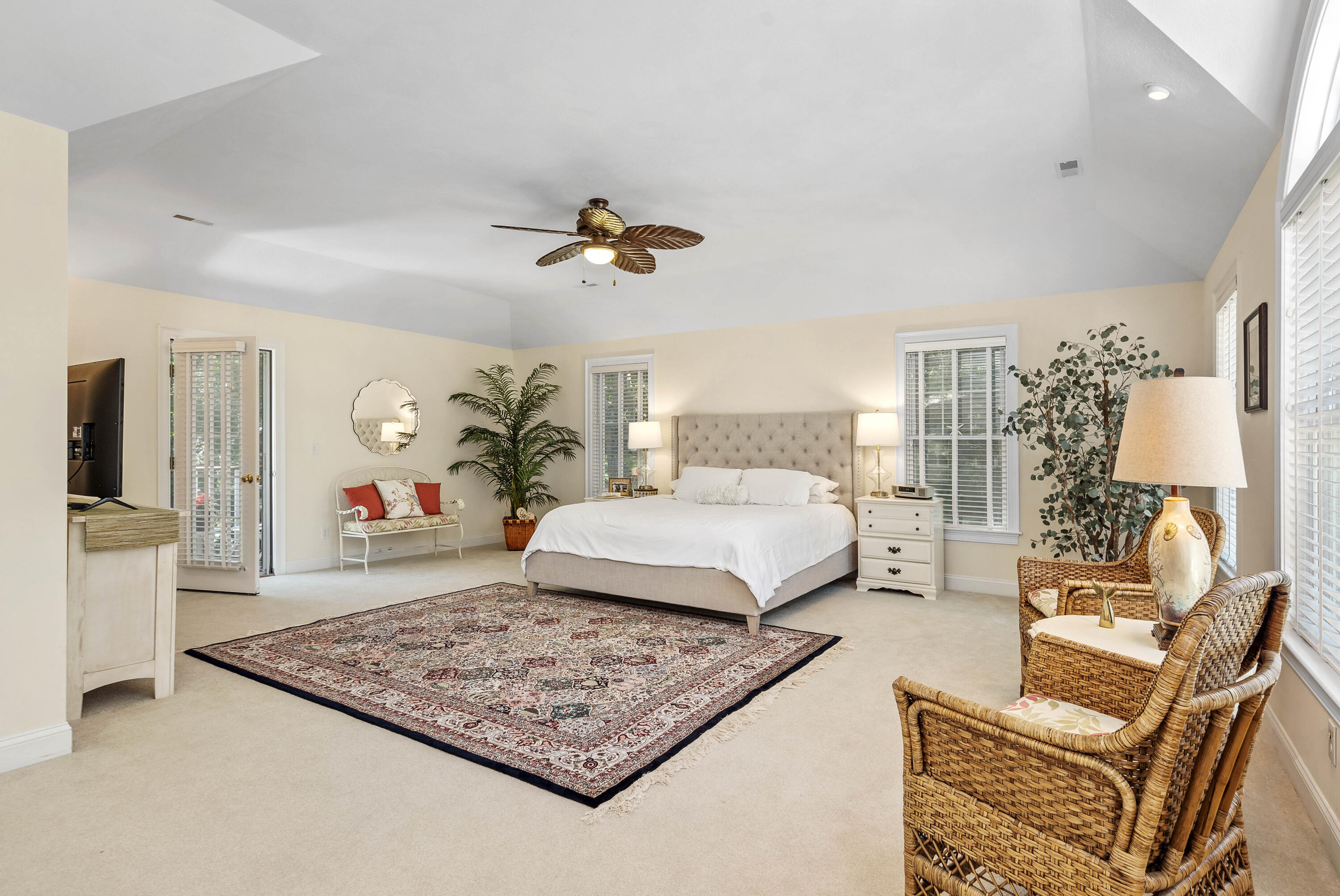 193 Fells Pond Road Mashpee, MA 02649 - Photo 20 of 33 a bedroom with a large bed a rug and potted plant