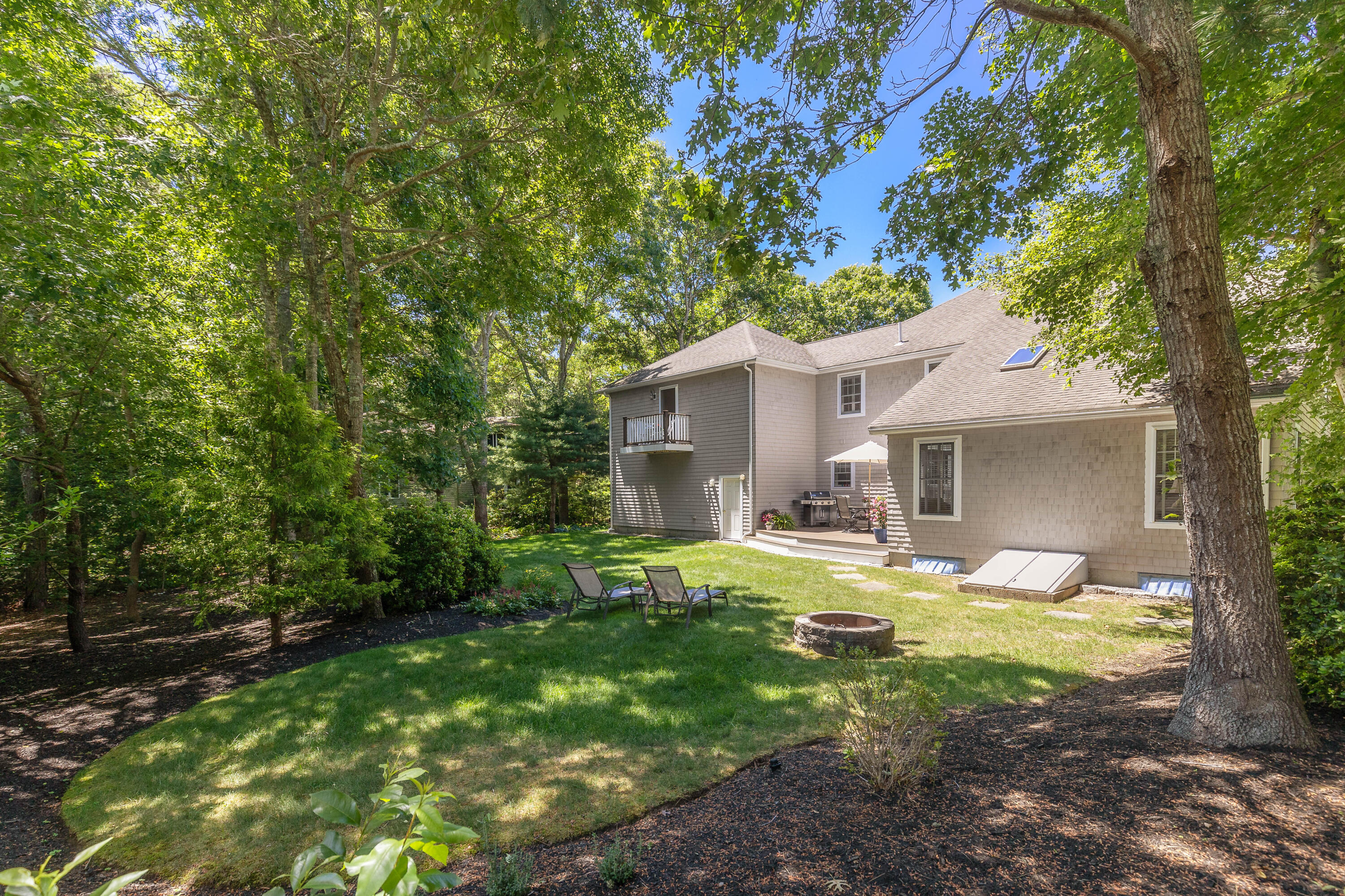 193 Fells Pond Road Mashpee, MA 02649 - Photo 26 of 33 a front view of a house with garden