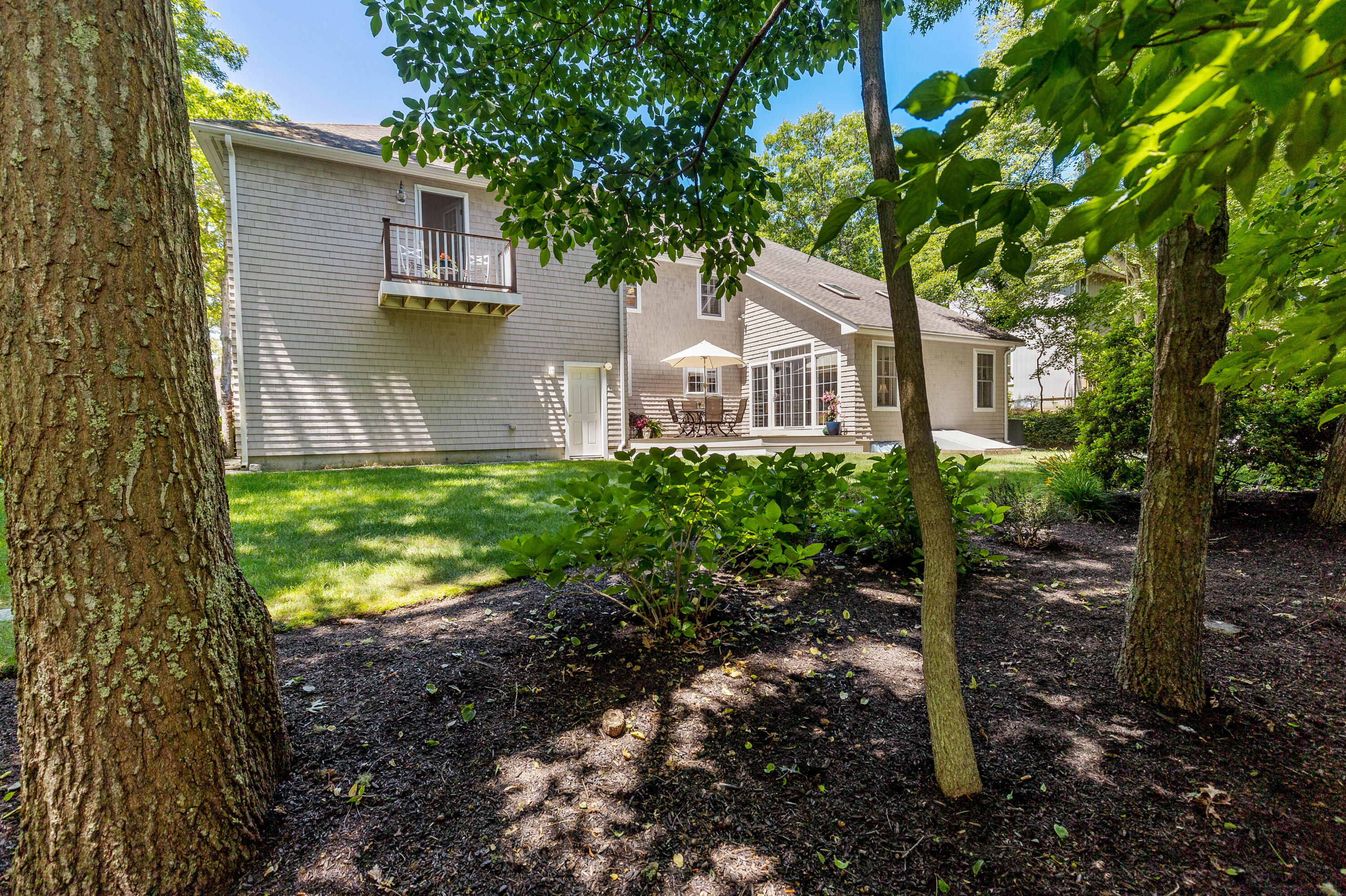 193 Fells Pond Road Mashpee, MA 02649 - Photo 30 of 33 a front view of a house with garden