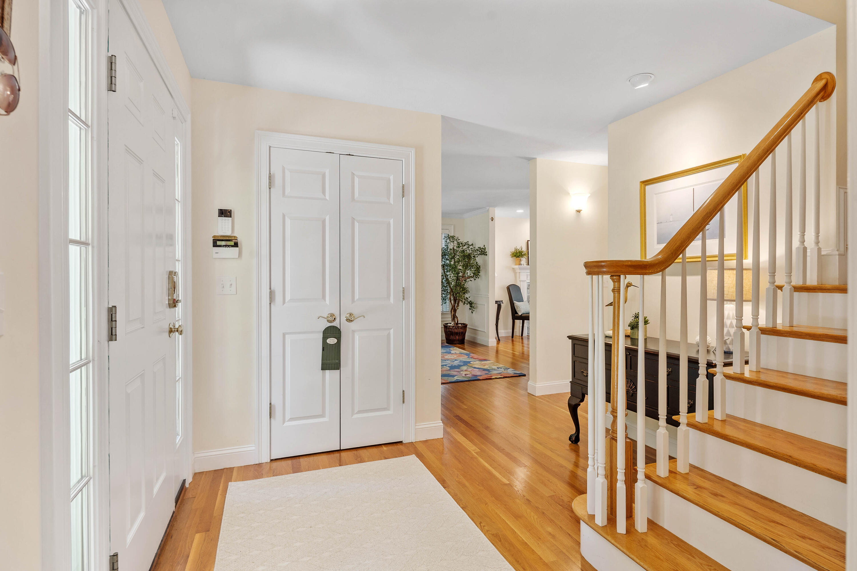 193 Fells Pond Road Mashpee, MA 02649 - Photo 3 of 33 a view of a hallway with wooden floor and staircase