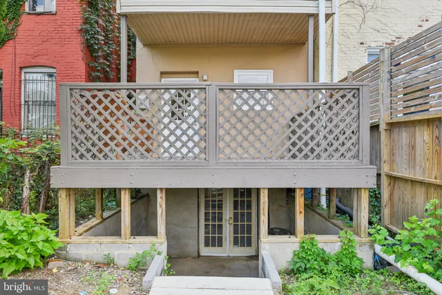 front view of a house with a large window