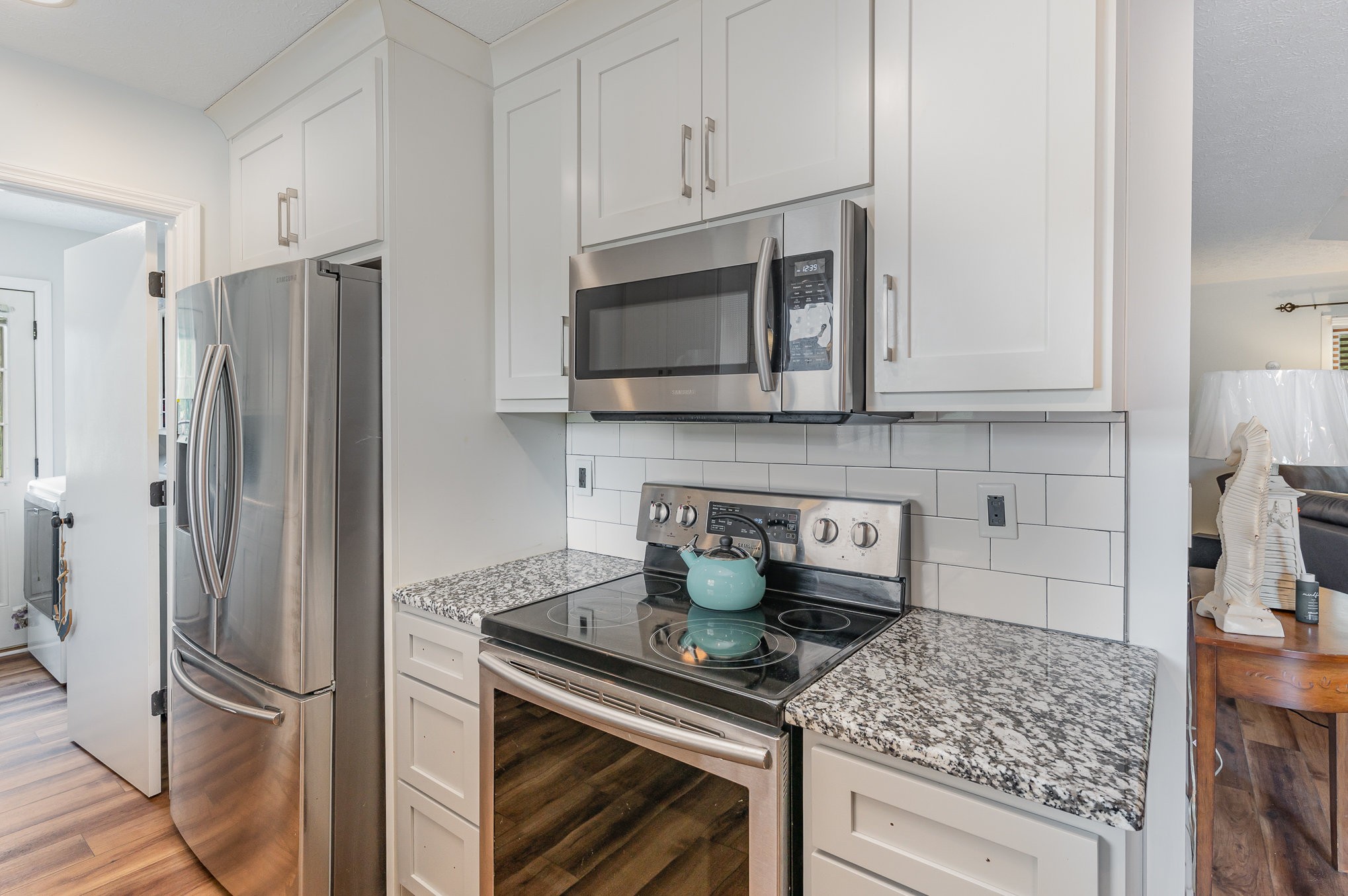 3831 Armstrong Road Springfield, TN 37172 - Photo 12 of 30 a kitchen with stainless steel appliances granite countertop a refrigerator stove and microwave