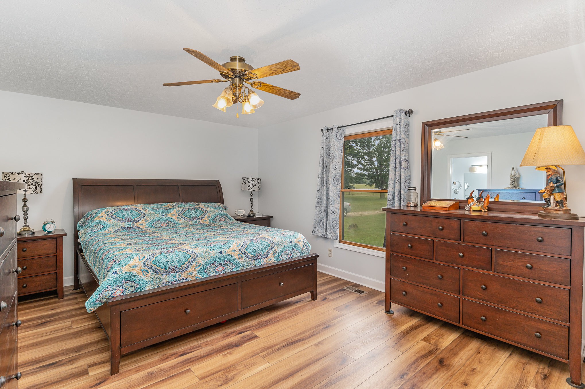 3831 Armstrong Road Springfield, TN 37172 - Photo 15 of 30 a bedroom with a bed and a mirror on the dresser