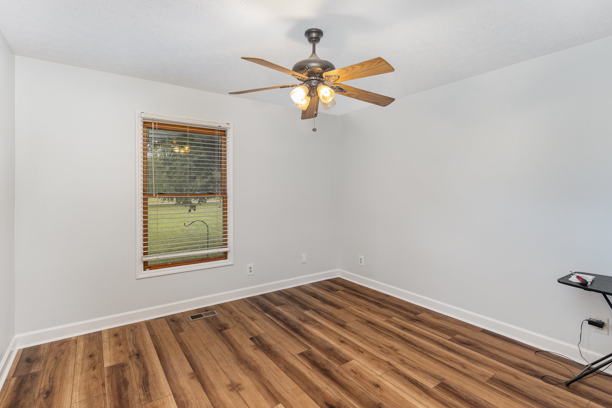 3831 Armstrong Road Springfield, TN 37172 - Photo 19 of 30 a view of empty room with wooden floor and fan