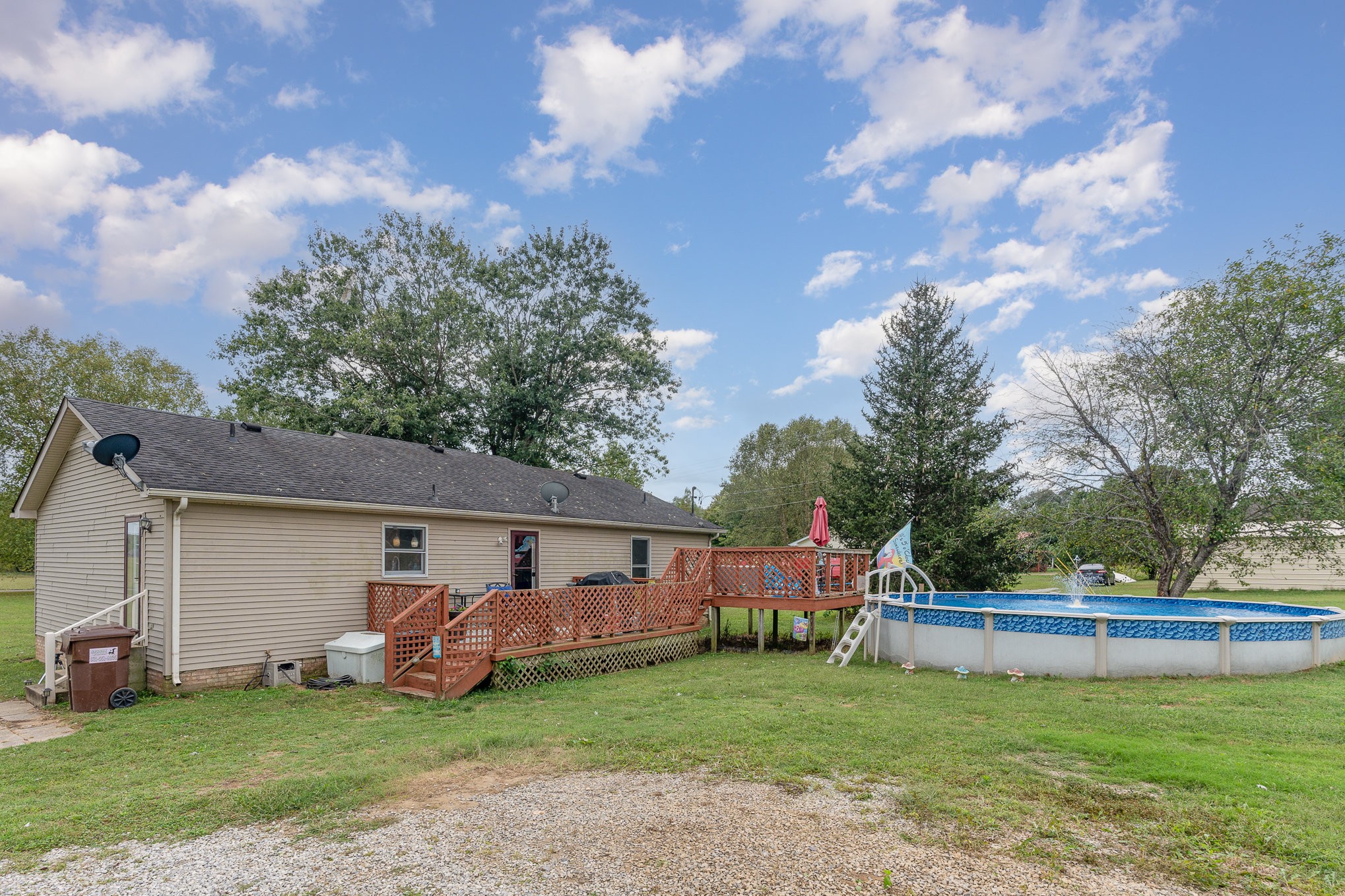 3831 Armstrong Road Springfield, TN 37172 - Photo 28 of 30 a front view of a house with a garden and trees