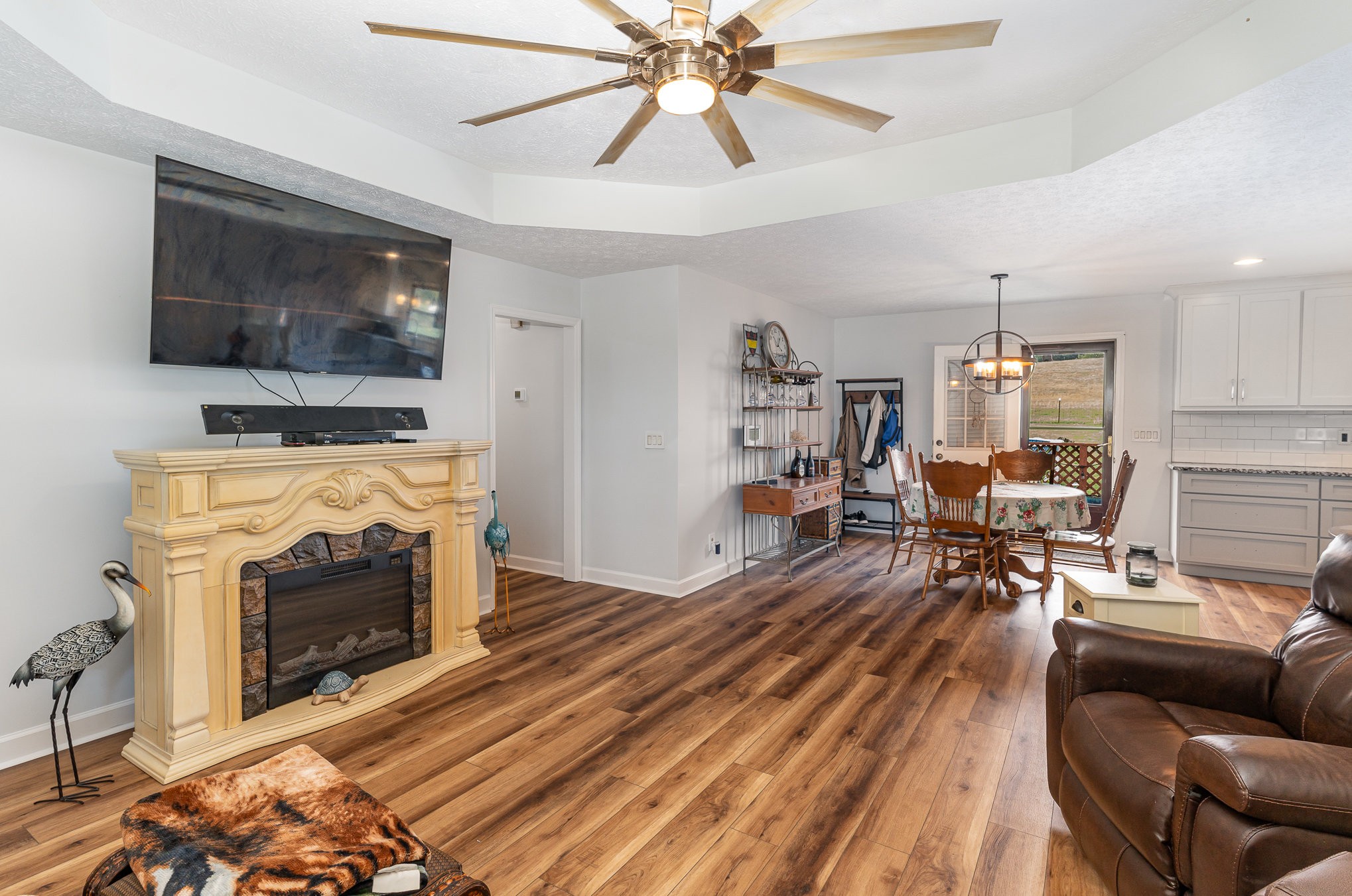 3831 Armstrong Road Springfield, TN 37172 - Photo 6 of 30 a living room with furniture a flat screen tv and a fireplace