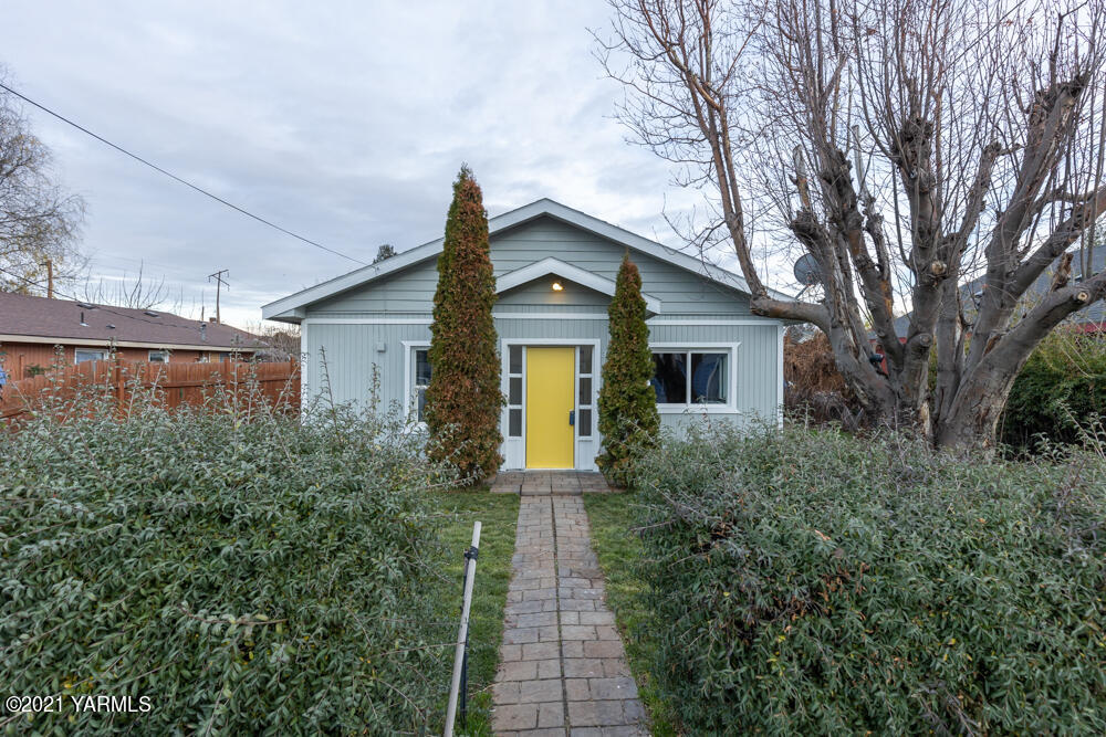 a front view of a house with yard