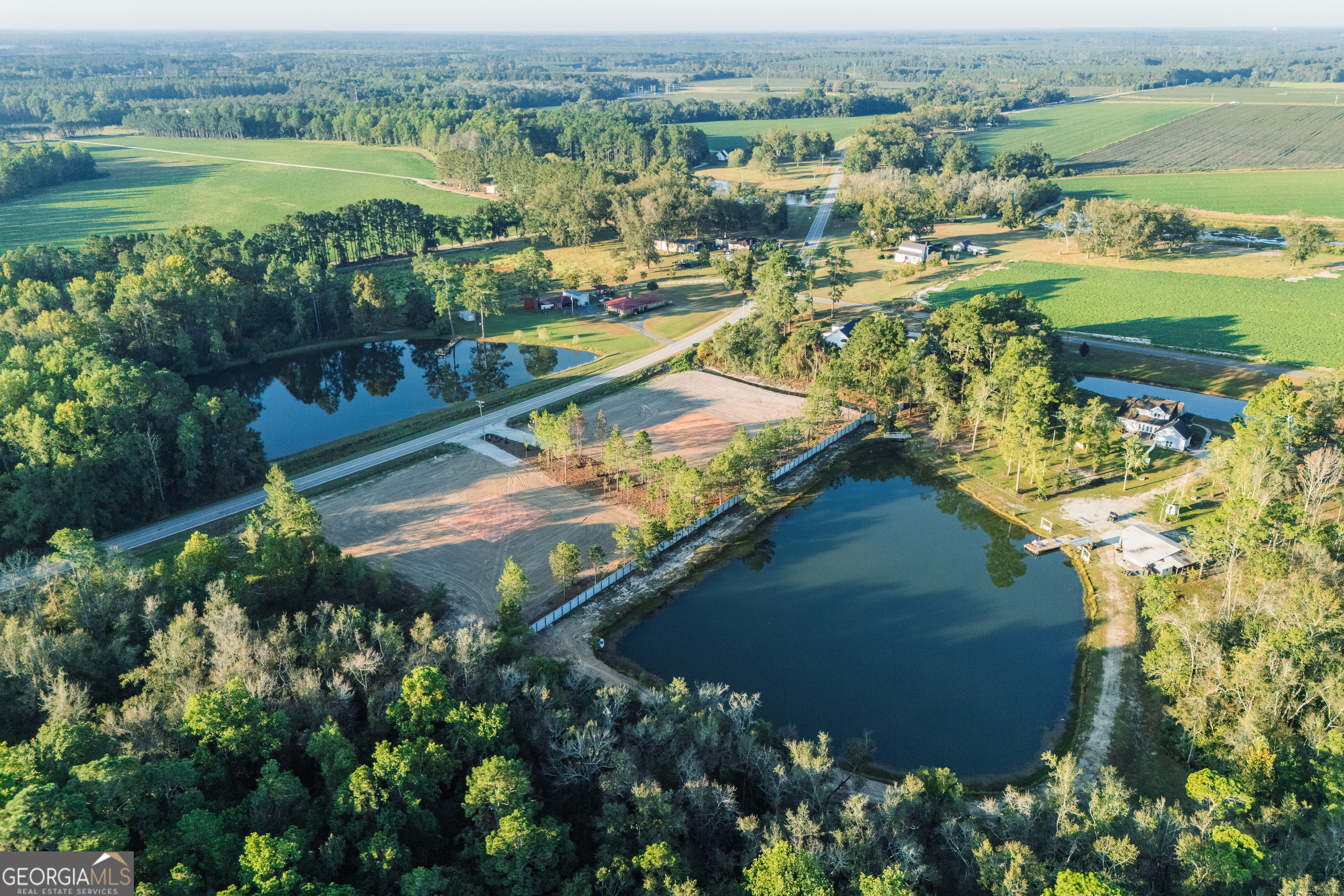 Lot 3 Pulaski Road Statesboro, GA 30458 - Photo 3 of 20 an aerial view of residential houses with outdoor space and lake view
