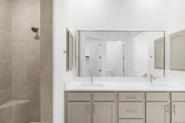 a bathroom with a sink and a mirror