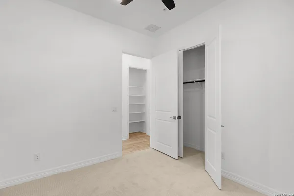 a view of a kitchen with wooden floor