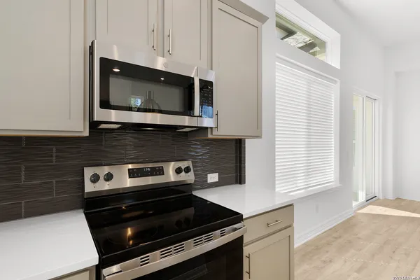 a kitchen with a stove and a microwave