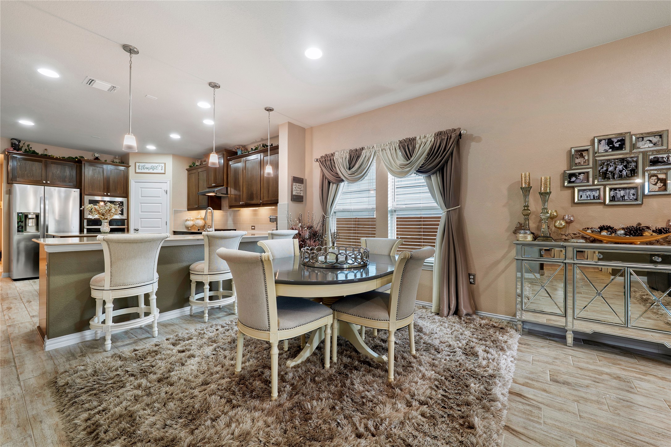 8721 Sikes Way Austin, TX 78747 - Photo 12 of 33 a dining room with furniture and wooden floor