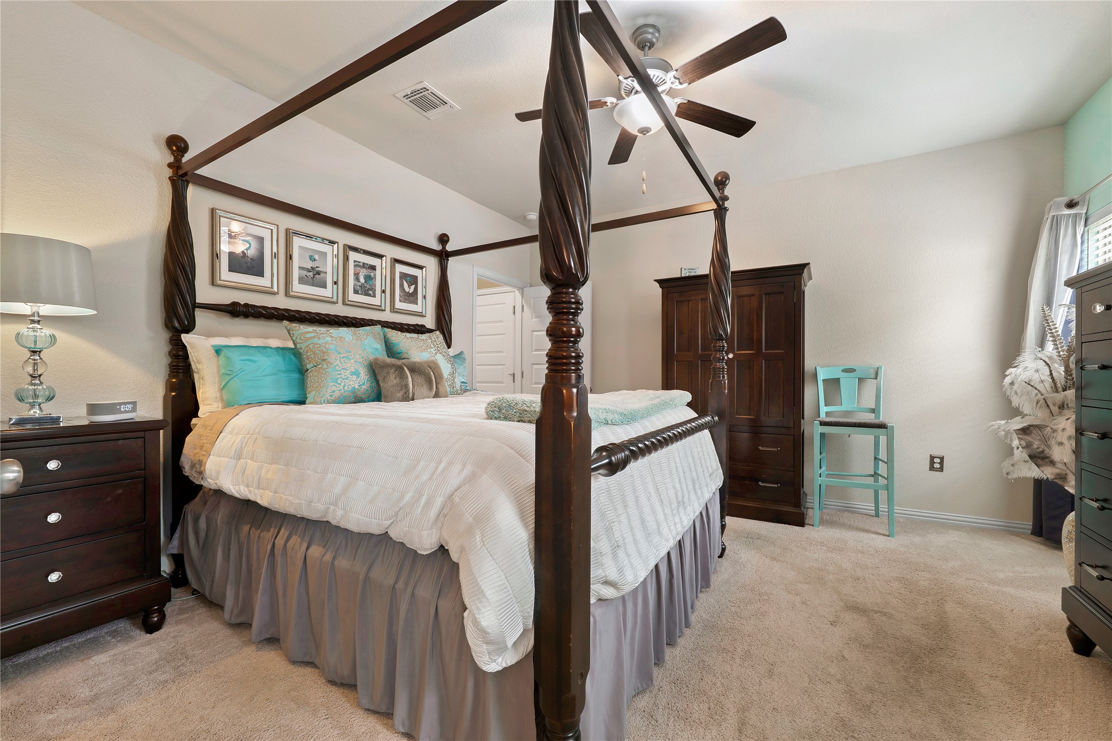 8721 Sikes Way Austin, TX 78747 - Photo 16 of 33 Primary bedroom featuring a ceiling fan, crown molding, and a tall vaulted ceiling
