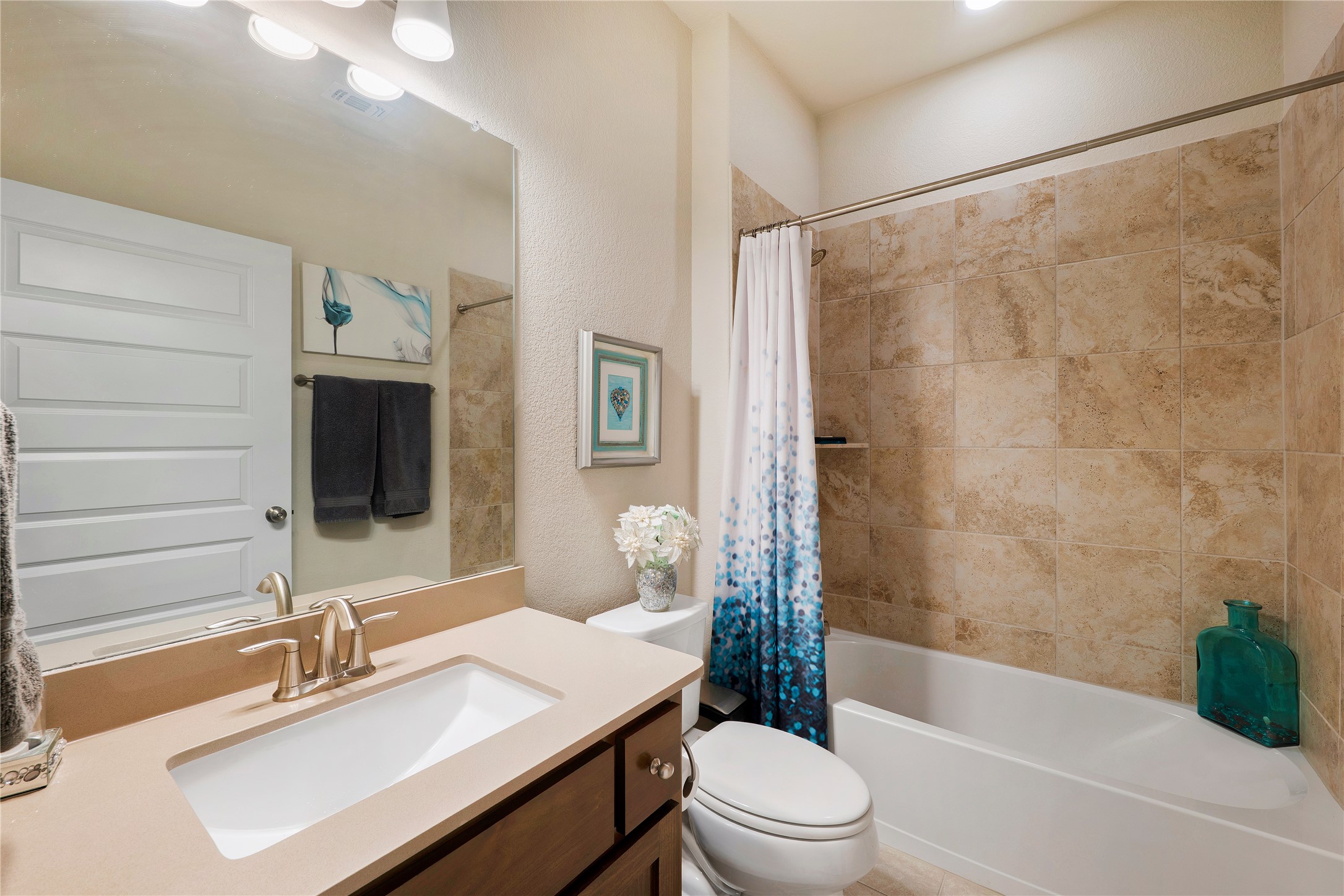 8721 Sikes Way Austin, TX 78747 - Photo 24 of 33 a bathroom with a sink toilet tub and shower