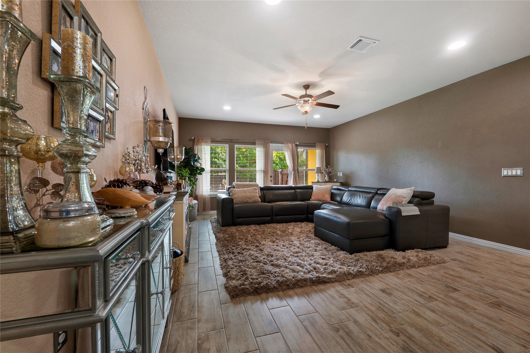 8721 Sikes Way Austin, TX 78747 - Photo 7 of 33 a living room with furniture and wooden floor