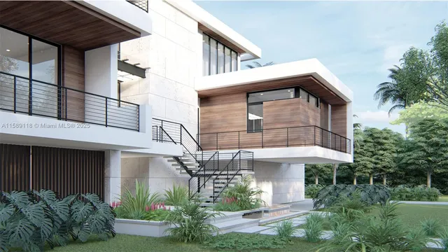 a view of a white house with large windows and a table and chairs under an umbrella