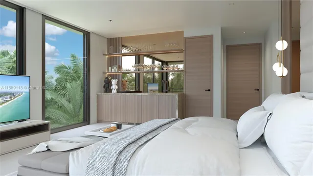 a bedroom with a large bed and a large window