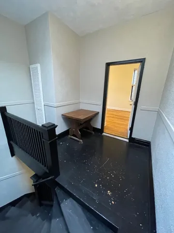 a view of a balcony with wooden floor