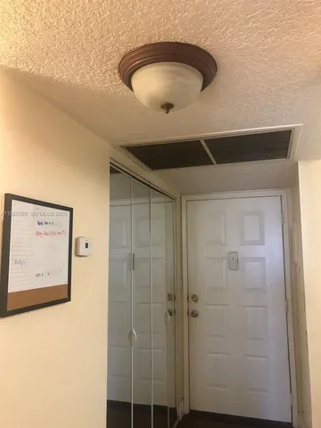 a bathroom with a mirror and a shower