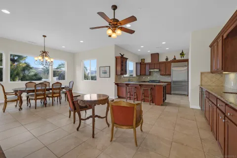 a living room with kitchen island furniture and a chandelier
