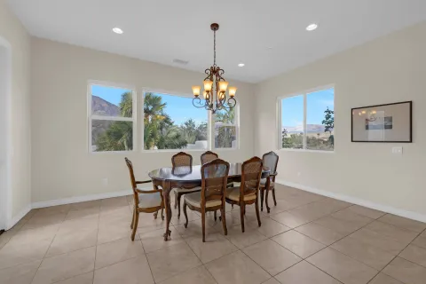 a dining room with furniture and window