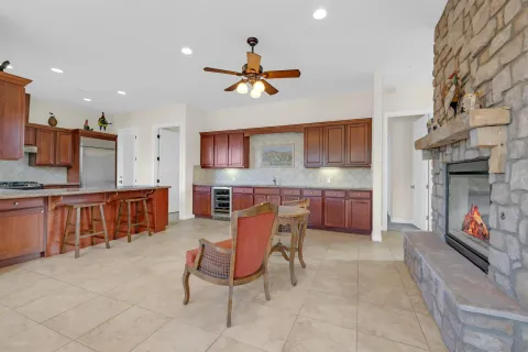 a kitchen with stainless steel appliances kitchen island granite countertop a sink and cabinets