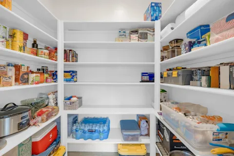 a cabinet with white and a book shelf