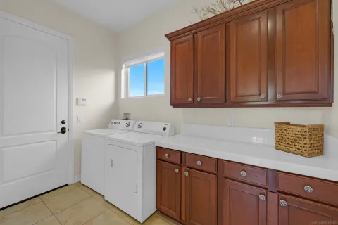 a kitchen with a sink cabinets and appliances