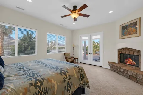 a bedroom with a bed and a fireplace
