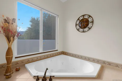 a bathroom with a bathtub and shower