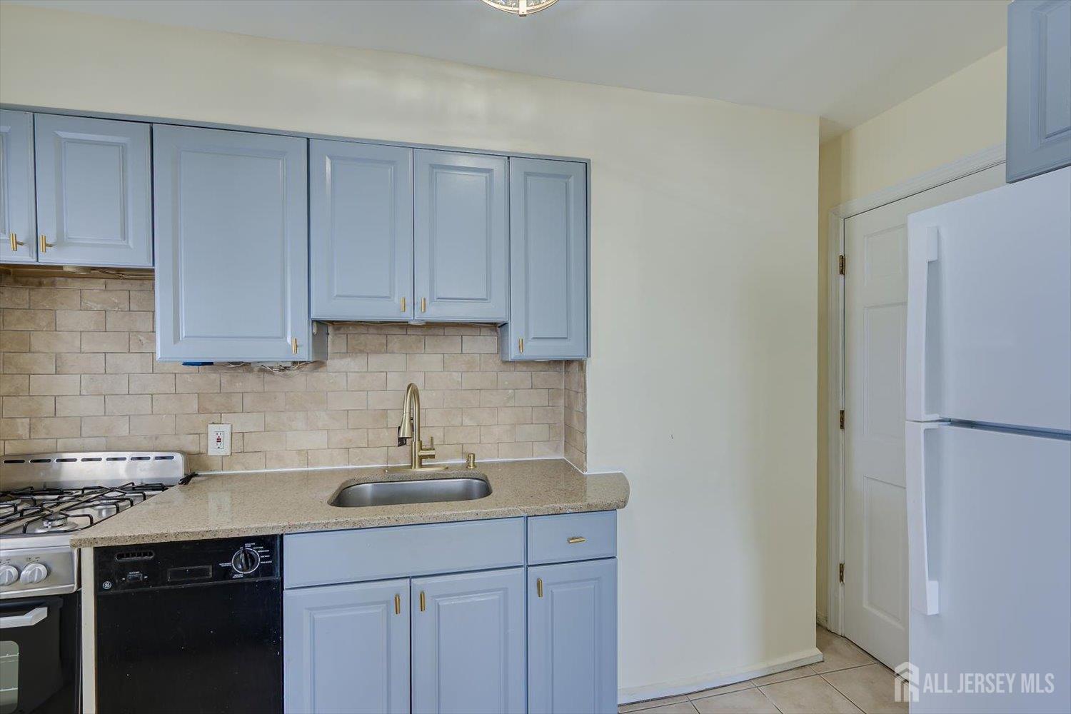 1 Coolidge Avenue Edison, NJ 08837 - Photo 11 of 27 a kitchen with a sink and cabinets