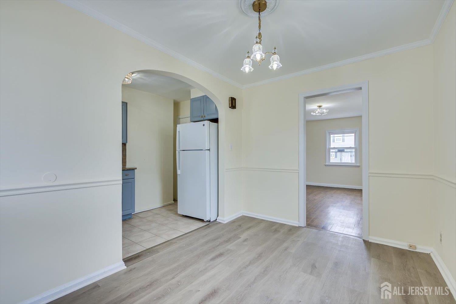 1 Coolidge Avenue Edison, NJ 08837 - Photo 13 of 27 wooden floor in an empty room with a window
