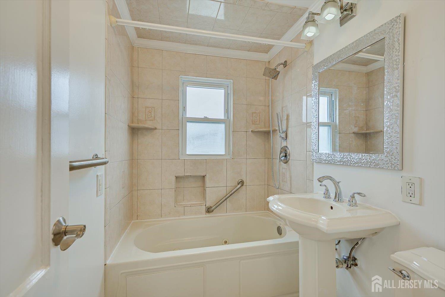 1 Coolidge Avenue Edison, NJ 08837 - Photo 20 of 27 a bathroom with a sink a toilet and shower