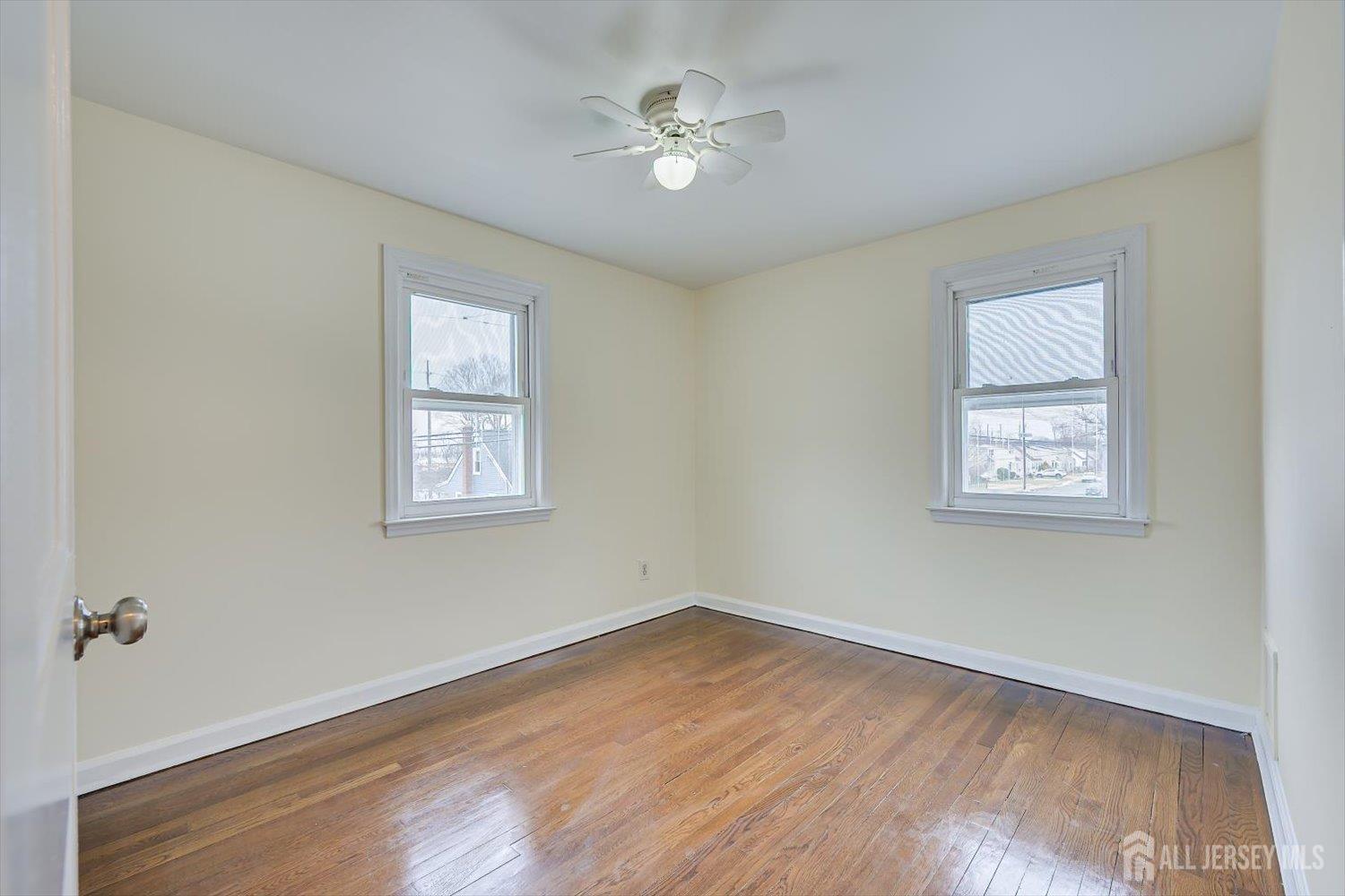 1 Coolidge Avenue Edison, NJ 08837 - Photo 25 of 27 an empty room with a window and a ceiling fan