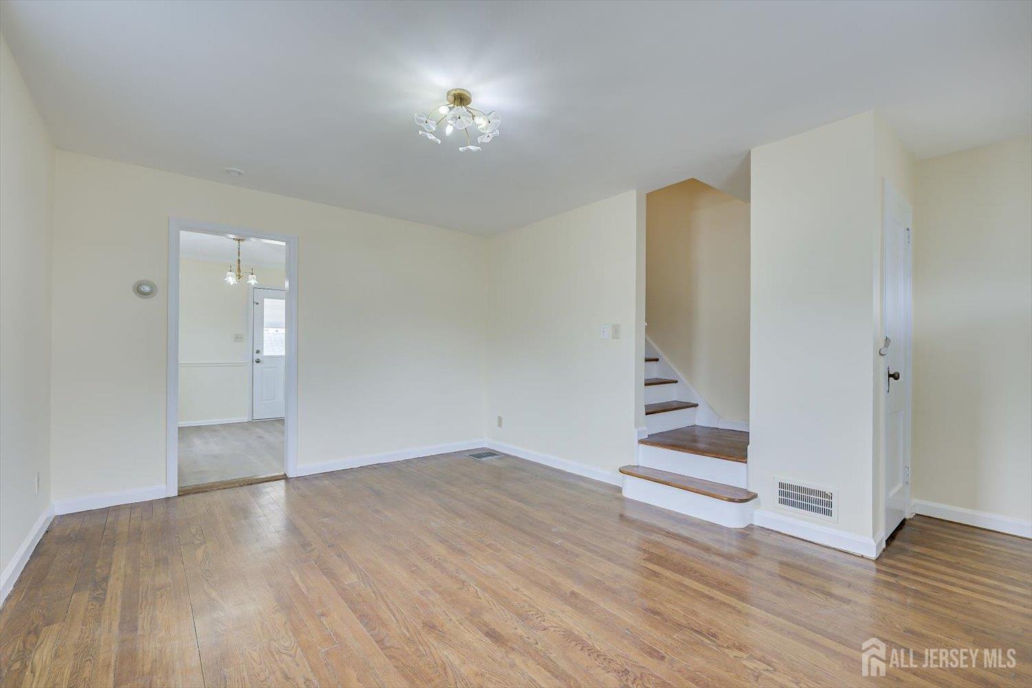 1 Coolidge Avenue Edison, NJ 08837 - Photo 9 of 27 wooden floor in an empty room with a window