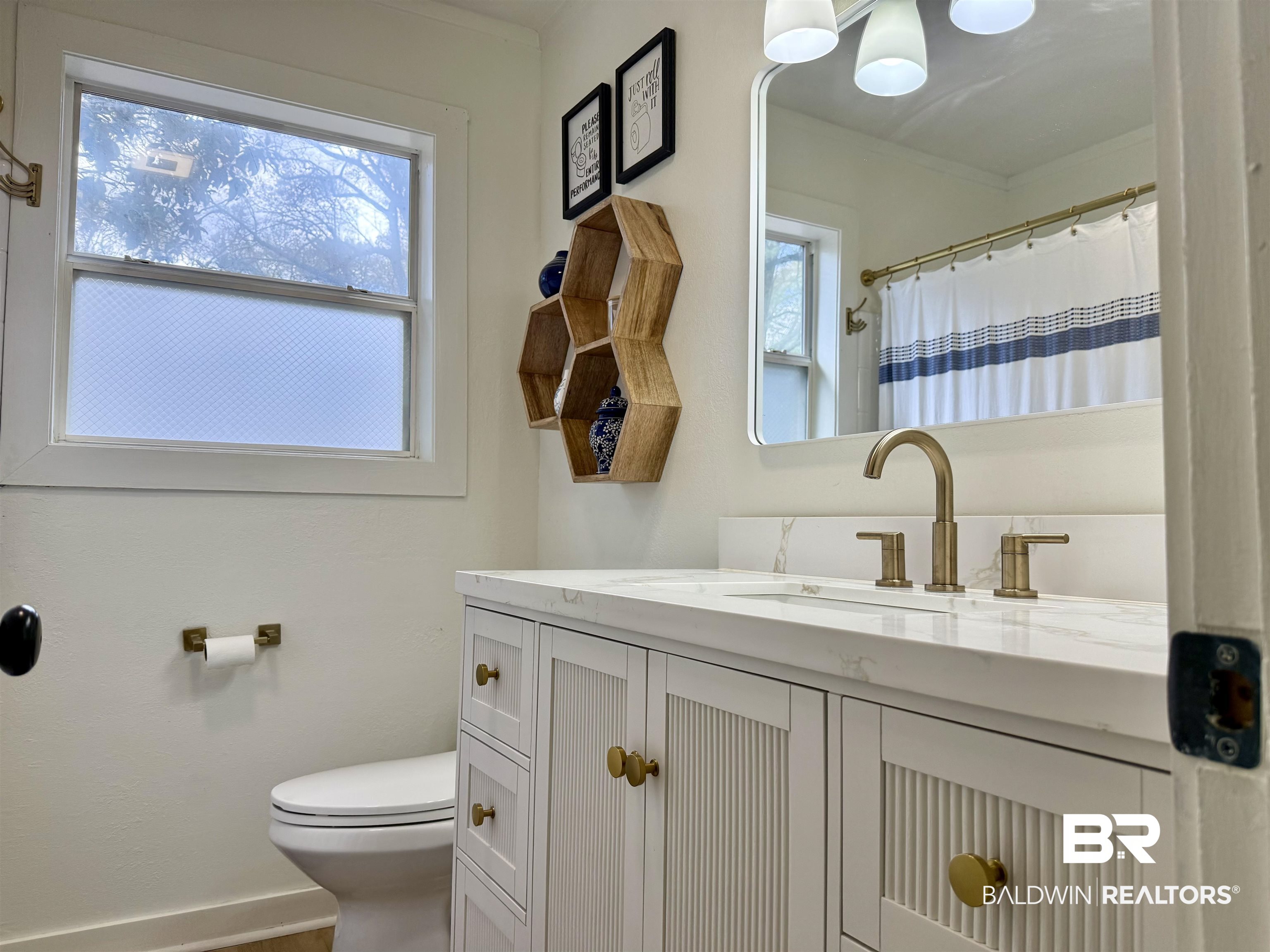 107 Dawson Street Brewton, AL 36426 - Photo 13 of 15 Bathroom with vanity and a shower with shower curtain
