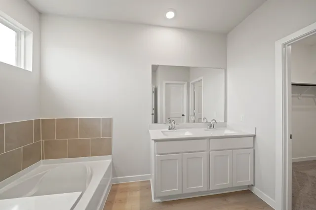 a bathroom with a sink a toilet and tub