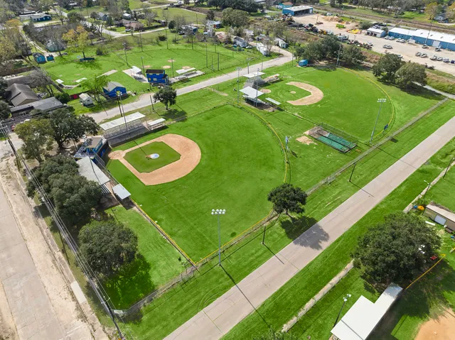 a view of a golf course with an outdoor space