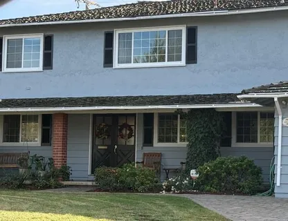 a front view of a house with garden