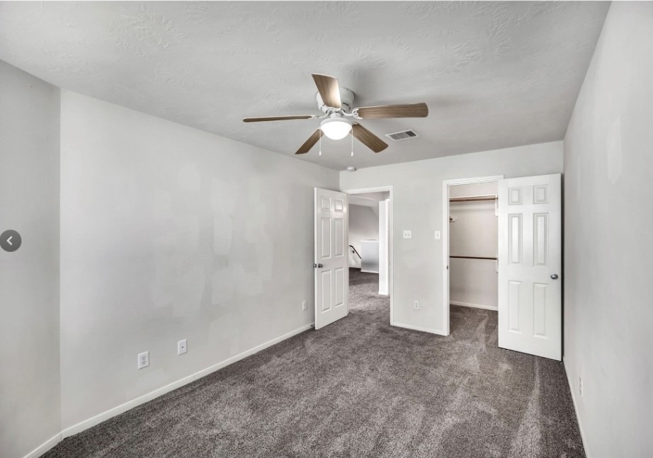 4507 Bridgestone Point Drive Spring, TX 77389 - Photo 17 of 21 a view of a big room with closet and a ceiling fan