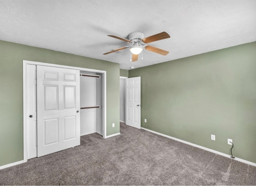 4507 Bridgestone Point Drive Spring, TX 77389 - Photo 18 of 21 an empty room with closet and a ceiling fan