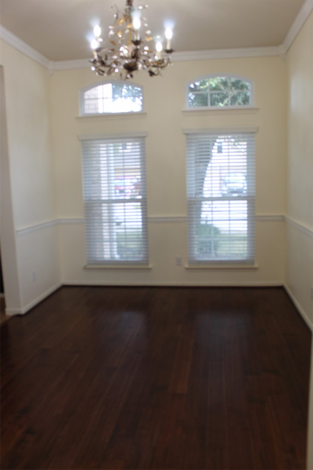 4507 Bridgestone Point Drive Spring, TX 77389 - Photo 7 of 21 a view of an empty room with wooden floor and a window
